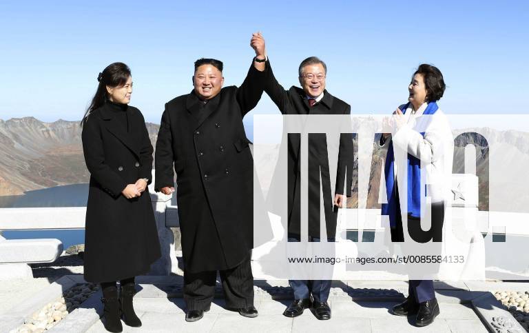 Inter-Korean summit North Korean leader Kim Jong Un (2nd from L), his wife Ri Sol Ju (L), South Korean President Moon Jae In (2nd from R) and his wife Kim Jung Sook pose on Mt. Paektu, a volcano on the North Korean-Chinese border, on Sept. 20, 2018. The highest peak on the Korean Peninsula is considered sacred by Koreans. (Pyeongyang Press Corps)