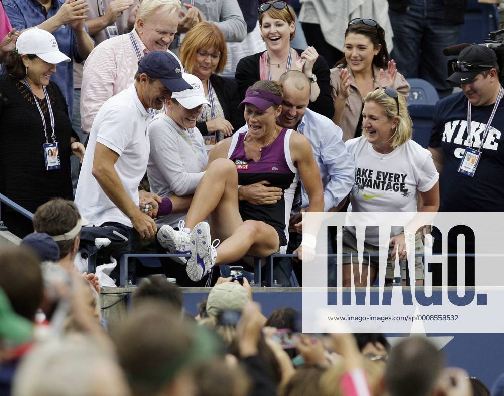 Samantha Stosur of Australia jumps in the seats where her family in the Women s Final in Arthur Ashe Stadium at the U.S. Open Tennis Championships at the Billie Jean King National Tennis Center in New York City on September 11, 2011. NYP20110911140