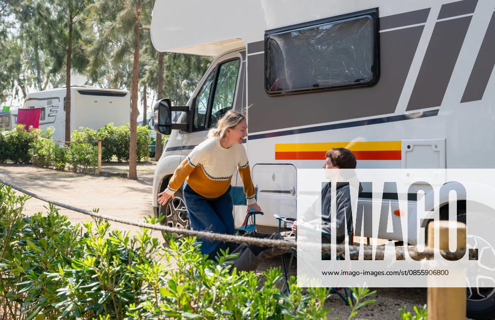 Couple relaxing by camper van at campsite enjoying outdoor travel Tarragona, Catalonia, Spain R_PJJZ260505A-2011209-01 ,model released, Symbolfoto