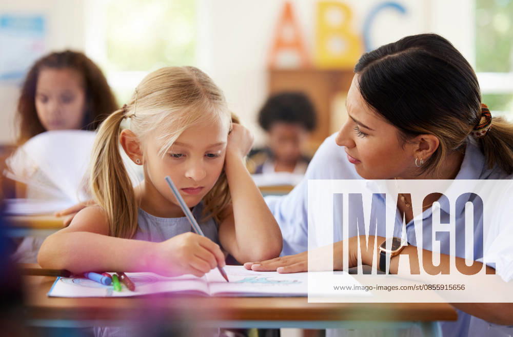 Teacher, learning and sad girl drawing in classroom, studying or assessment. Teaching, development and depressed kid or unhappy student with woman helping for art education with book in kindergarten (License=RF) ,model released, Symbolfoto