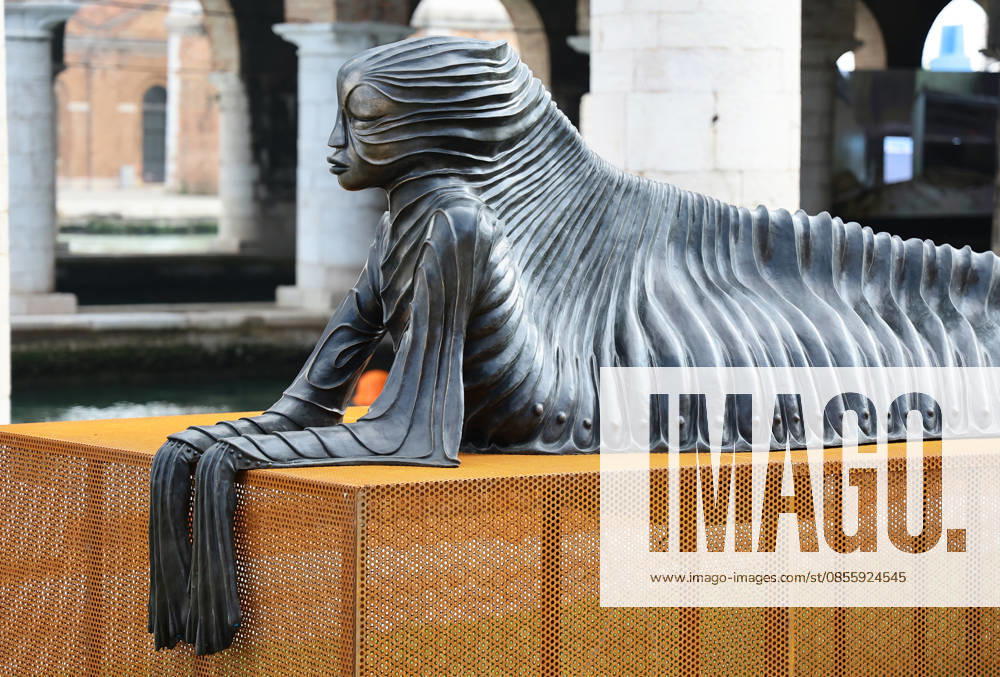 The 61st International Art Exhibition of the Venice Biennale - In Minor Keys by Koyo Kouoh - will take place from Saturday, May 9th to Sunday, November 22nd, 2026 (pre-opening May 6th, 7th, and 8th) in the institutional venues of the Giardini, the Arsenale, and various venues throughout Venice. Pictured: Wangechi Mutu s bronze sculpture SimbiSiren.
