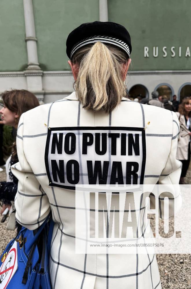 The 61st International Art Exhibition Biennale Arte 2026 will take place in Venice from May 9 to November 22, 2026 The event will be held in Arsenale and Giardini Photo In front of the Russia Pavilion Woman with jacket No Putin, No War