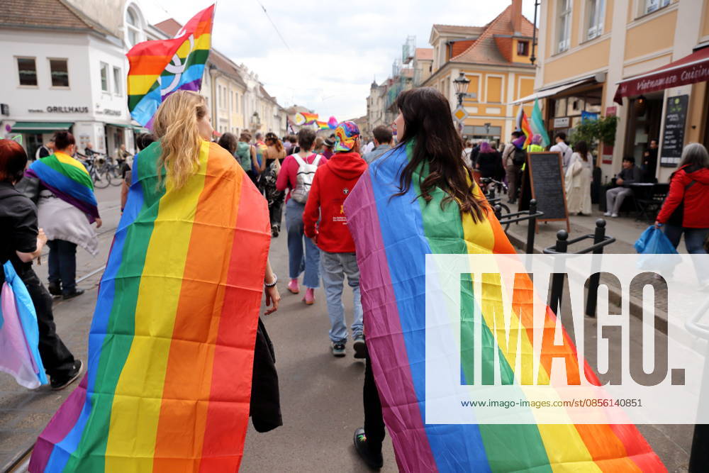 People walk with rainbow flags in Friedrich Ebert Straße during a demonstration for Christopher Street Day in Potsdam, May 9, 2026 CSD in Potsdam