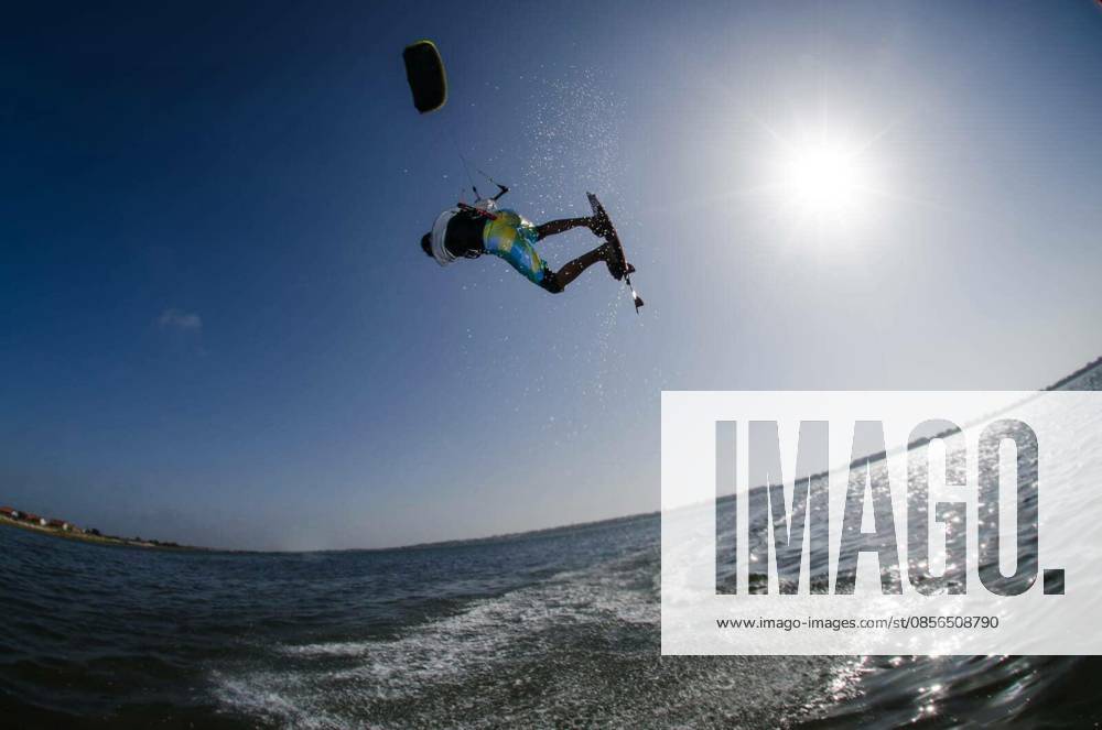 Kiteboarder flying over the water on a sunny day. model released Symbolfoto