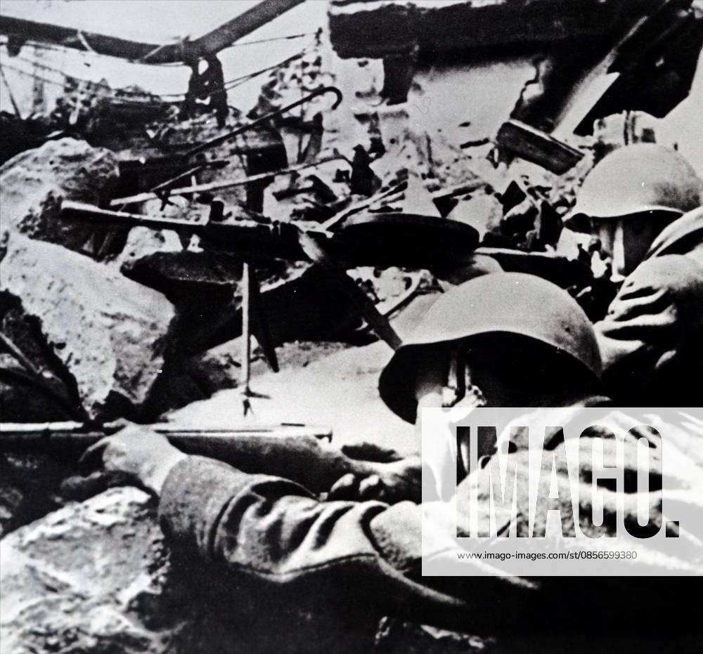 Photograph of Soviet Red Army soldiers during a street battle during the Siege of Berlin Photograph of Soviet Red Army soldiers during a street battle during the Siege of Berlin which helped bring on the German surrender in World War Two 1945. Dated 20th Century Editorial use only. All other uses to be cleared with the copyright owner (World History Archive), in advance., WHA_097_0965.jpg, Soviet Red Army; soldiers; street battle; Siege of Berlin; German surrender; World War Two; 1945; military; conflict; warfare; historical; victory; combat; soldiers in action; battle scene; Soviet Union; Berlin; Eastern Front; war; history; 20th century; armed forces; Soviet soldiers; fighting; war zone; Berlin siege; German defeat;