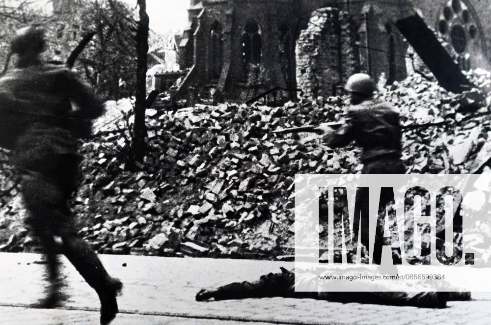 Photograph of Soviet Red Army soldiers during a street battle during the Siege of Berlin Photograph of Soviet Red Army soldiers during a street battle during the Siege of Berlin which helped bring on the German surrender in World War Two 1945. Dated 20th Century Editorial use only. All other uses to be cleared with the copyright owner (World History Archive), in advance., WHA_097_0966.jpg, Soviet Red Army; soldiers; street battle; Siege of Berlin; German surrender; World War Two; 1945; military; conflict; warfare; historical; victory; combat; soldiers in action; Soviet Union; Berlin; battle scene; war; history; 20th century; Eastern Front; European history; Russian soldiers; Soviet military; Berlin siege; German defea