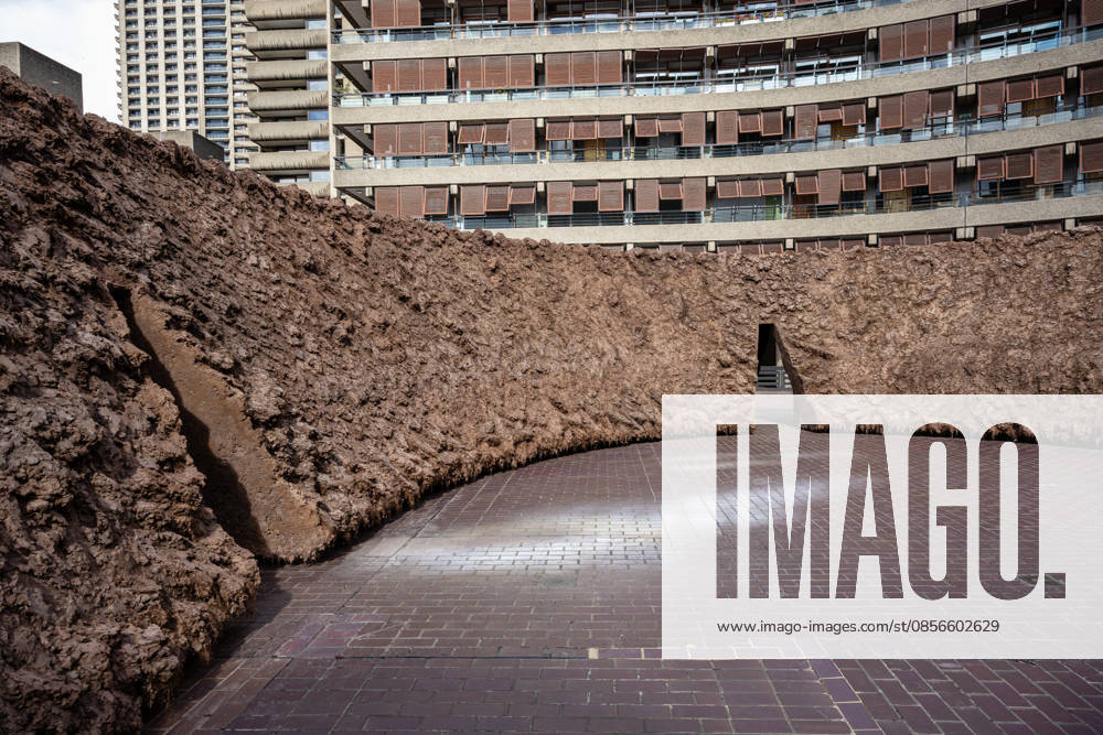 Delcy Morelos: origo at the Barbican Sculpture Court, London, UK 14 May 2026 origo, a monumental earthen sculpture by Colombian artist Delcy Morelos, on display at the Barbican Sculpture Court, London, UK, on 14 May 2026. The work spans roughly 24 x 18 metres and is hand-built with several tonnes of soil and aromatic spices including cinnamon and coffee, marking the first large-scale artistic commission in the Sculpture Court in ten years, on view from 15 May until 31 July 2026., Credit:Pete Speller Avalon