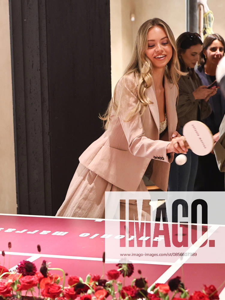 IPA84680180 - Rome, Laila Hasanovic attends the Antonio Marras boutique event. Pictured: Laila Hasanovic plays ping pong.