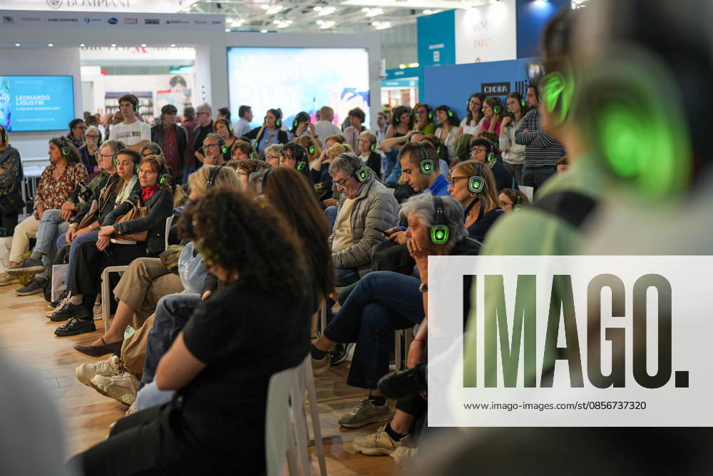 IPA84723881 - Turin. Second day of the 18th edition of the Turin International Book Fair entitled The World Saved by Kids. The fair will remain open from May 14 to 18, 2026 at Lingotto Fiere Pictured: audience listens to audiobooks