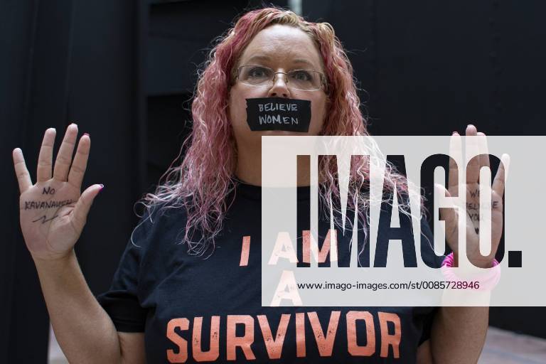 A demonstrator against the Senate confirmation of Judge Brett Kavanaugh stands in the Hart Senate Office Building on Capitol Hill in Washington, DC on September 27, 2018.