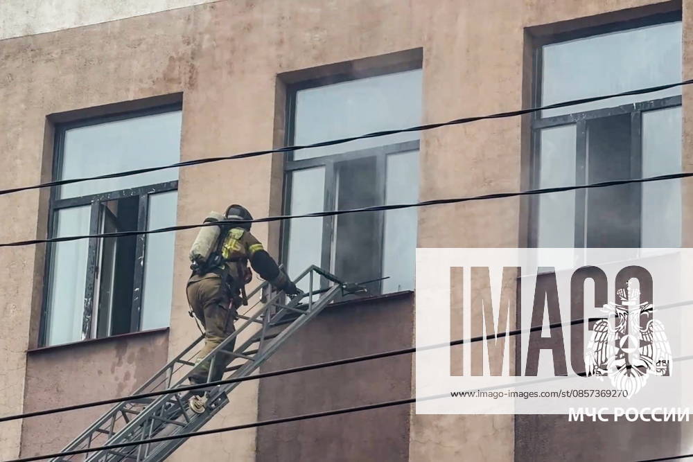RUSSIA, IRKUTSK - MAY 23, 2026: A firefighter battles a fire at Research Institute of Precious and Rare Metals and Diamonds. Video grab. Best quality available. Russia Emergencies Ministry TASS 92905861