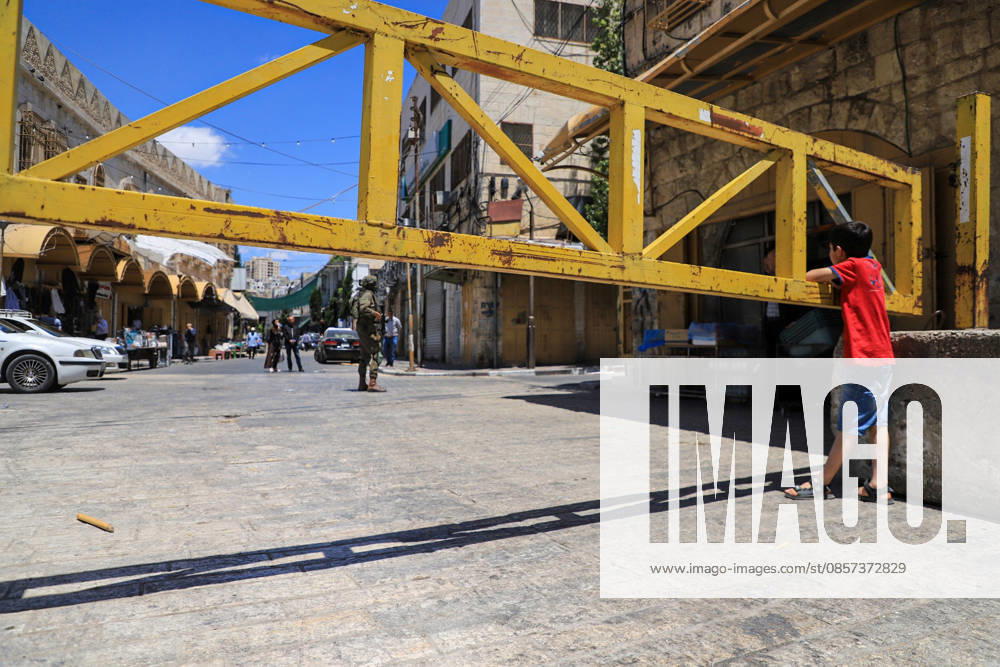Israeli forces block entrances with iron barriers during settler raid in Hebron HEBRON, PALESTINE - MAY 23: Israeli settlers, under the protection of Israeli forces, raid the Old City area of Hebron in the southern West Bank, Palestine, on May 23, 2026. Blocking entrances and exits with iron barriers during the raid, Israeli forces restricted the movement of Palestinians. Amer Shallodi Anadolu Hebron West Bank. Editorial use only. Please get in touch for any other usage.