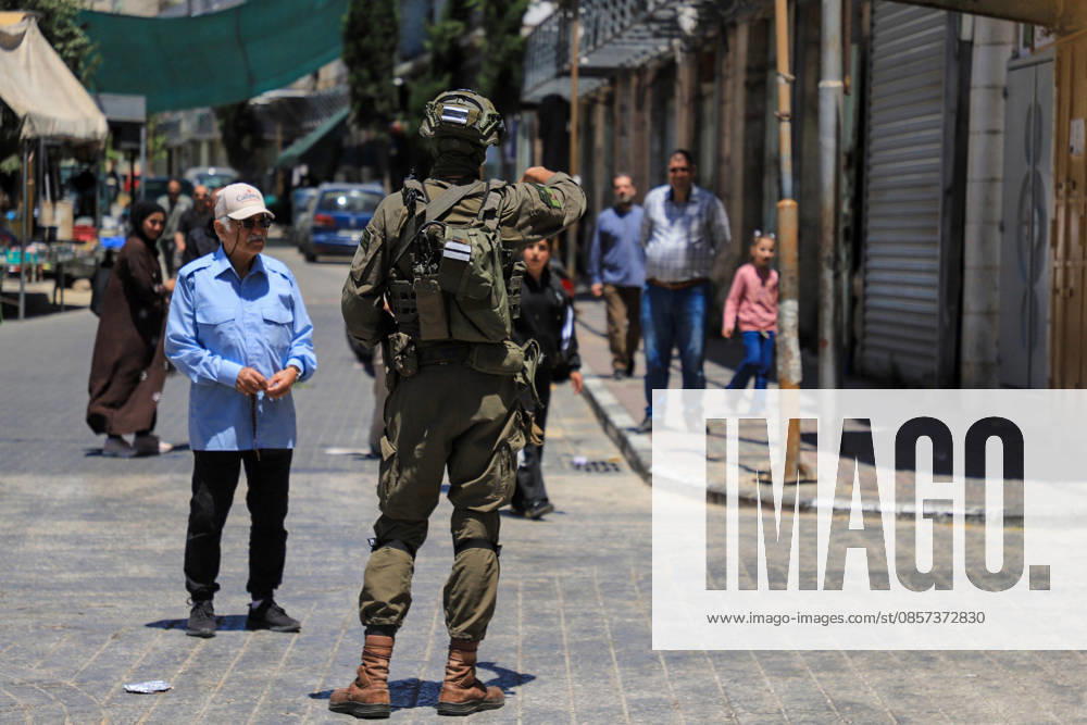 Israeli forces block entrances with iron barriers during settler raid in Hebron HEBRON, PALESTINE - MAY 23: Israeli settlers, under the protection of Israeli forces, raid the Old City area of Hebron in the southern West Bank, Palestine, on May 23, 2026. Blocking entrances and exits with iron barriers during the raid, Israeli forces restricted the movement of Palestinians. Amer Shallodi Anadolu Hebron West Bank. Editorial use only. Please get in touch for any other usage.