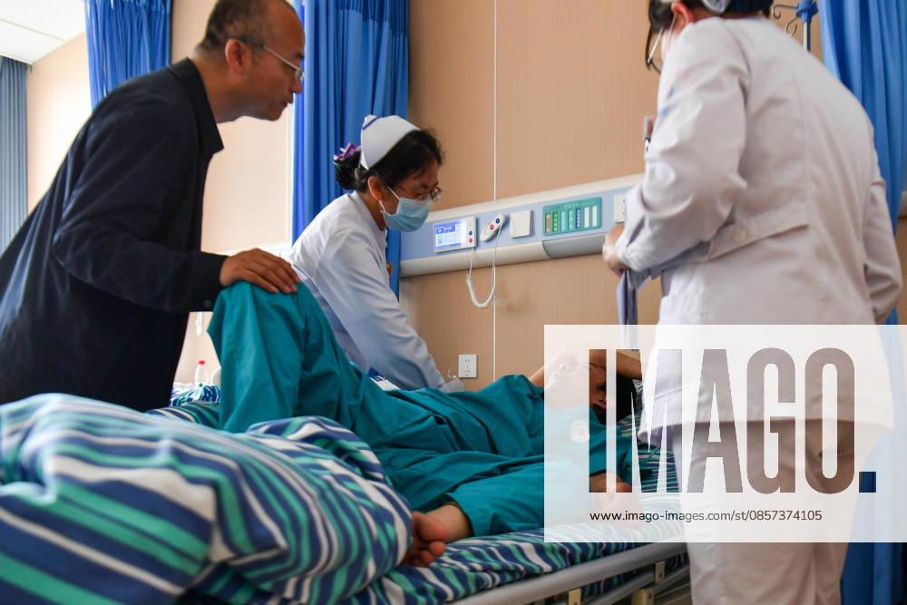 (260523) -- QINYUAN, May 23, 2026 -- Medical staff take care of an injured worker at a hospital in Qinyuan County, north China s Shanxi Province, May 23, 2026. The coal mine accident in north China s Shanxi Province has left 82 people dead, with nine others still unaccounted for, according to the county s emergency management bureau. The gas explosion occurred on Friday at the Liushenyu coal mine in Qinyuan County. The province has sent 755 people including rescuers and medical personnel to the site. Rescue efforts are ongoing. A total of 123 people have been sent to hospitals for treatment, including two in critical condition and two in serious condition, while 33 others have returned home. ) (SpotNews) CHINA-SHANXI-COAL MINE-ACCIDE
