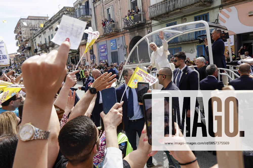 Visit of Pope Leo XIV to Acerra Along the streets of Acerra, near Naples, crowds of worshippers gathered to greet Pope Leo XIV as he passed through the town in the popemobile. Thousands of faithful lined the streets waving flags, applauding, and praying during the Popes pastoral visit, transforming the town into a moment of collective celebration and devotion.A deeply symbolic event marked by strong public participation and religious fervour. Acerra May 23, 2026. _BPH0374