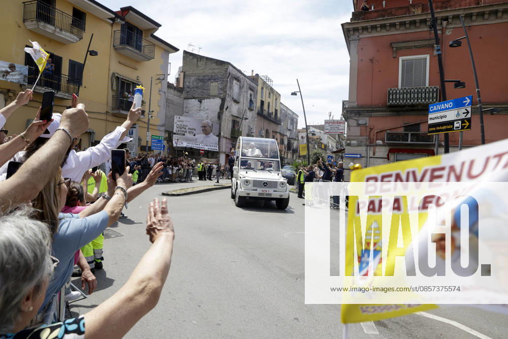 Visit of Pope Leo XIV to Acerra Along the streets of Acerra, near Naples, crowds of worshippers gathered to greet Pope Leo XIV as he passed through the town in the popemobile. Thousands of faithful lined the streets waving flags, applauding, and praying during the Popes pastoral visit, transforming the town into a moment of collective celebration and devotion.A deeply symbolic event marked by strong public participation and religious fervour. Acerra May 23, 2026. _BPH0562