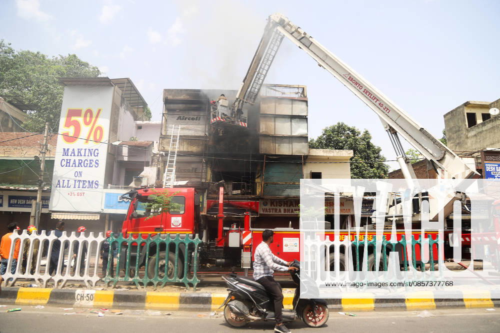 Firefighting operations underway after fire breaks out at a commercial building in Kingsway Camp near GTB Nagar metro station New Delhi, May 23 (ANI): Firefighting operations underway after fire breaks out at a commercial building in Kingsway Camp near GTB Nagar metro station, in New Delhi on Saturday. New Delhi Delhi India