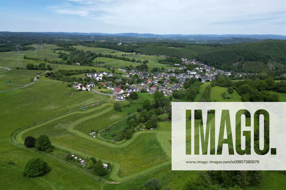 Aerial view spring spring in Siegerland A lush green meadow is mowed in the foreground by a tractor with a mower mowed in the background the place Siegen Oberschelden spring spring in Siegerland on 23 05 2026 in Siegen Germany