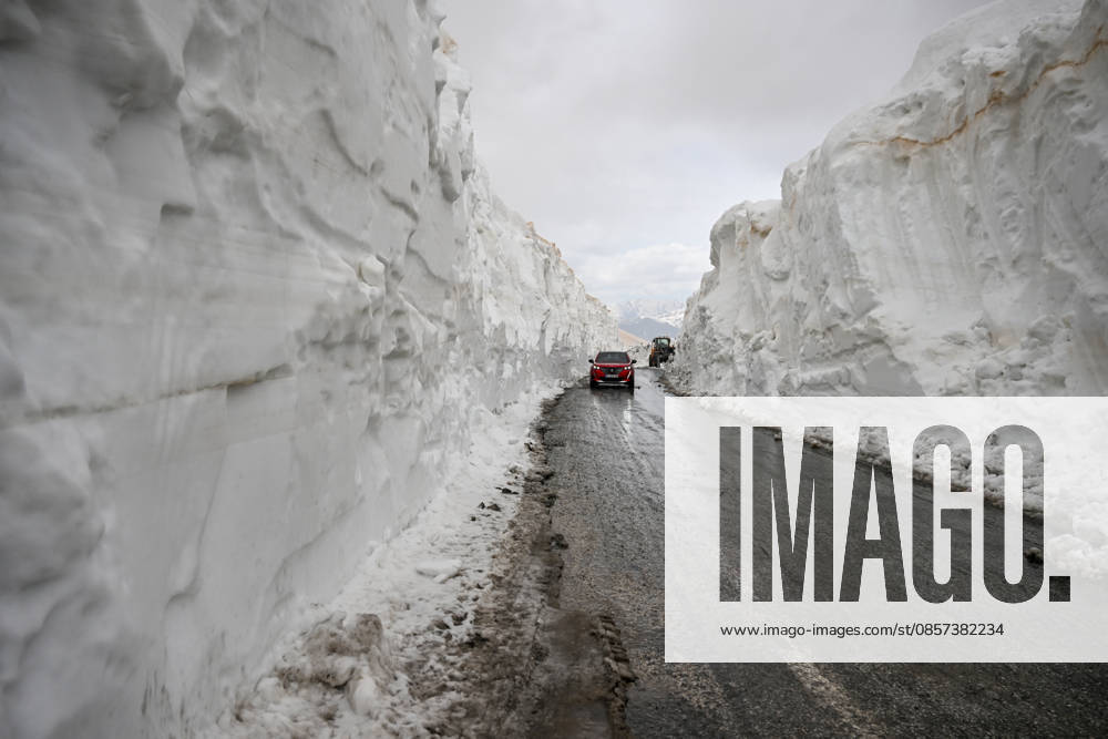Van-Bahcesaray highway, closed for months due to avalanche risk, cleared of snow VAN, TURKIYE - MAY 23: A car passes by as the teams from the Gorentas Maintenance Station of the 11th Regional Directorate of Highways carry out snow removal work on the Van-Bahcesaray highway in Van, Turkiye on May 23, 2026. Closed since December due to adverse weather conditions and avalanche risks, the highway was partially opened to single-lane traffic following a challenging 20-day effort through meters-high snow corridors. The final decision to fully open the road to traffic awaits an assessment by the Avalanche Risk Determination and Monitoring Commission. Ozkan Bilgin Anadolu Van Turkey. Editorial use only. Please get in touch for any other usage.