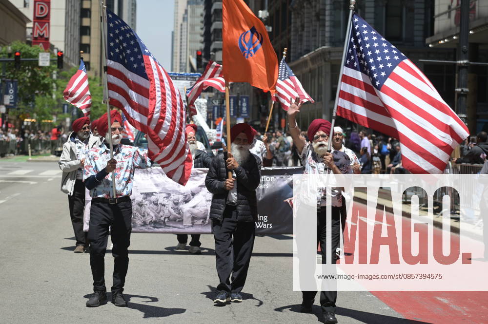 Chicago Memorial Day Parade CHICAGO, ILLINOIS - MAY 23: The Chicago Memorial Day Parade proceeds through the city center, with participants carrying American flags and marching in formation on Saturday, May 23, 2026. The event, held each year before Memorial Day, pays solemn tribute to the men and women of the U.S. Armed Forces who made the ultimate sacrifice. Jacek Boczarski Anadolu Illinois United States. Editorial use only. Please get in touch for any other usage.