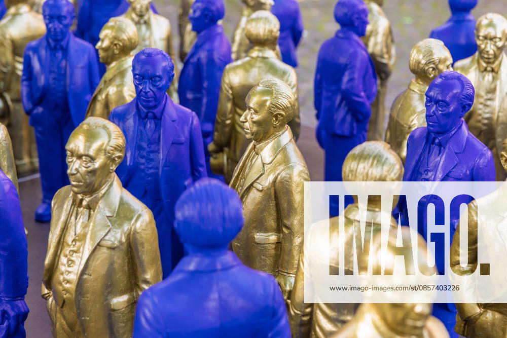 Adenauer art installation in Bad Honnef 23 05 26 Art installation by artist Ottmar Hörl with 200 gold and blue sculptures of the first Federal Chancellor Konrad Adenauer on the church square in Bad Honnef The presentat