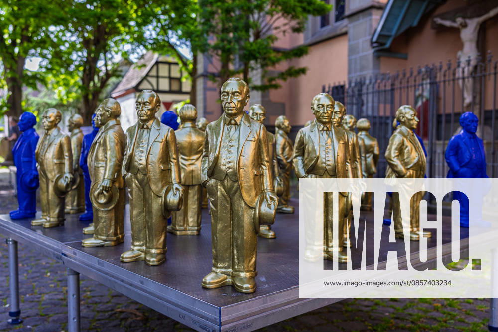 Adenauer art installation in Bad Honnef 23 05 26 Art installation by artist Ottmar Hörl with 200 gold and blue sculptures of the first Federal Chancellor Konrad Adenauer on the church square in Bad Honnef The presentat