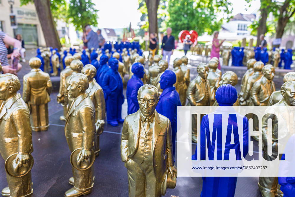 Adenauer art installation in Bad Honnef 23 05 26 Art installation by artist Ottmar Hörl with 200 gold and blue sculptures of the first Federal Chancellor Konrad Adenauer on the church square in Bad Honnef The presentat