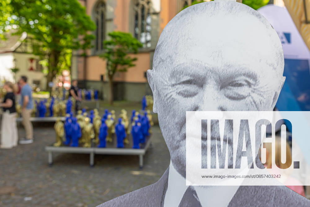 Adenauer art installation in Bad Honnef 23 05 26 Art installation by artist Ottmar Hörl with 200 gold and blue sculptures of the first Federal Chancellor Konrad Adenauer on the church square in Bad Honnef The presentat