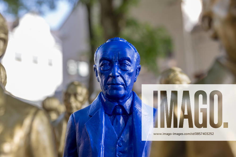 Adenauer art installation in Bad Honnef 23 05 26 Art installation by artist Ottmar Hörl with 200 gold and blue sculptures of the first Federal Chancellor Konrad Adenauer on the church square in Bad Honnef The presentat