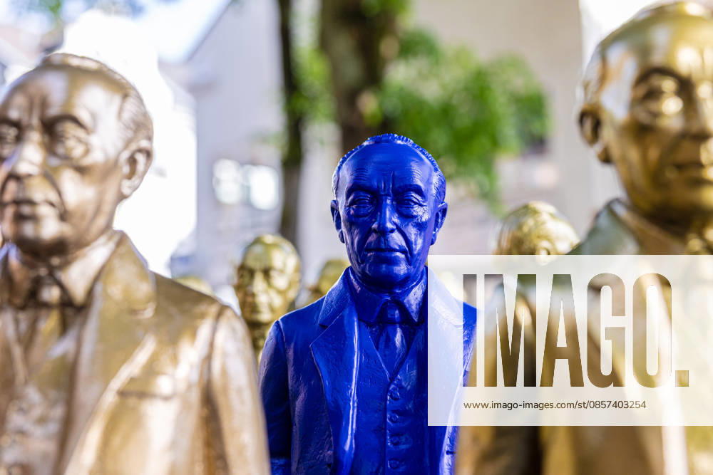 Adenauer art installation in Bad Honnef 23 05 26 Art installation by artist Ottmar Hörl with 200 gold and blue sculptures of the first Federal Chancellor Konrad Adenauer on the church square in Bad Honnef The presentat