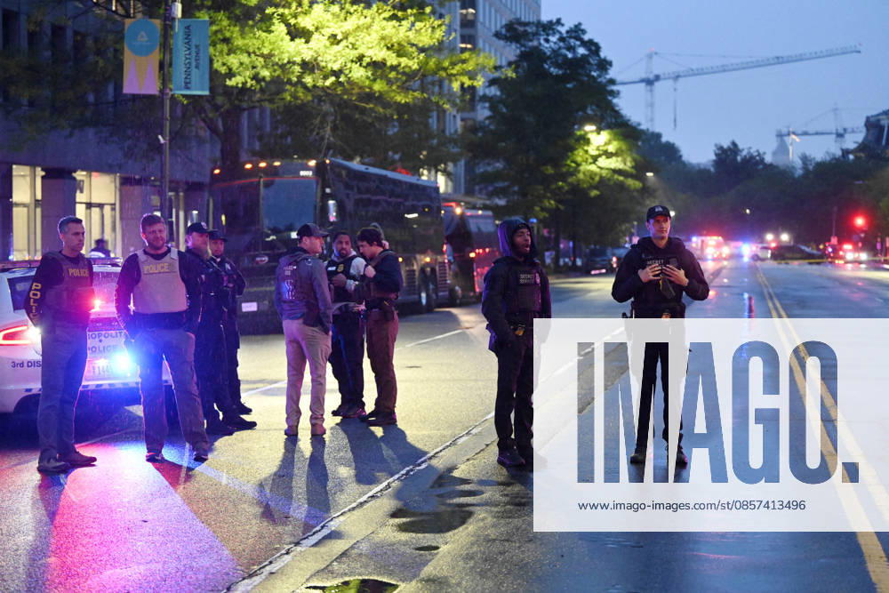 Multiple Shots Fired Half A Block From White House Complex Law enforcement work the scene after multiple rapid-fire gunshots ring out outside the White House on May 23, 2026 in Washington, DC. A suspect was killed after opening fire on a Secret Service checkpoint outside the White House Saturday evening. Photo by Olivier Douliery ABACAPRESS.COM Washington DC United States