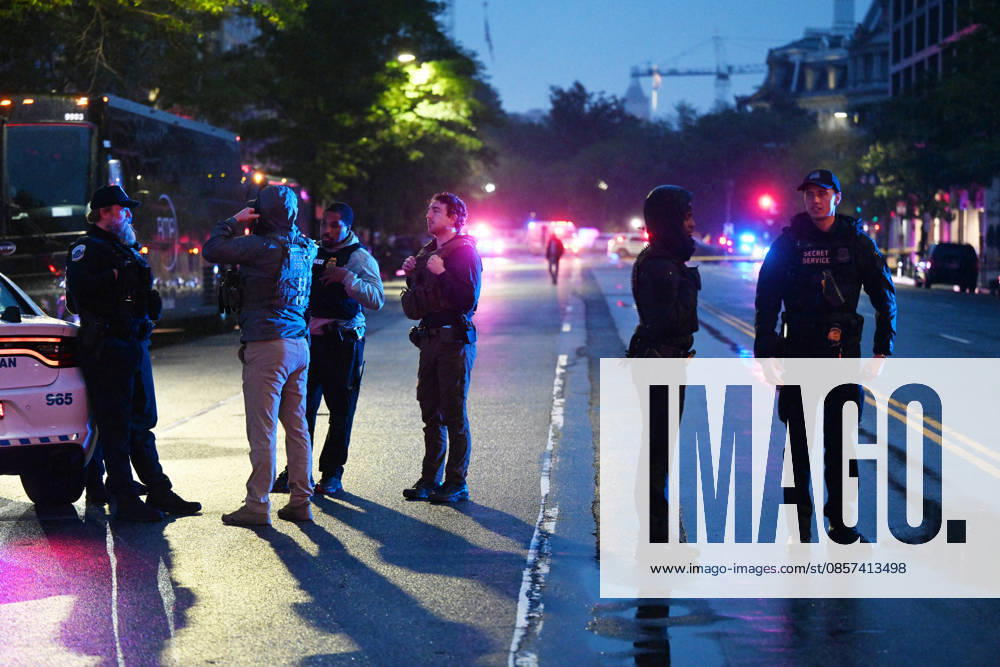 Multiple Shots Fired Half A Block From White House Complex Law enforcement work the scene after multiple rapid-fire gunshots ring out outside the White House on May 23, 2026 in Washington, DC. A suspect was killed after opening fire on a Secret Service checkpoint outside the White House Saturday evening. Photo by Olivier Douliery ABACAPRESS.COM Washington DC United States