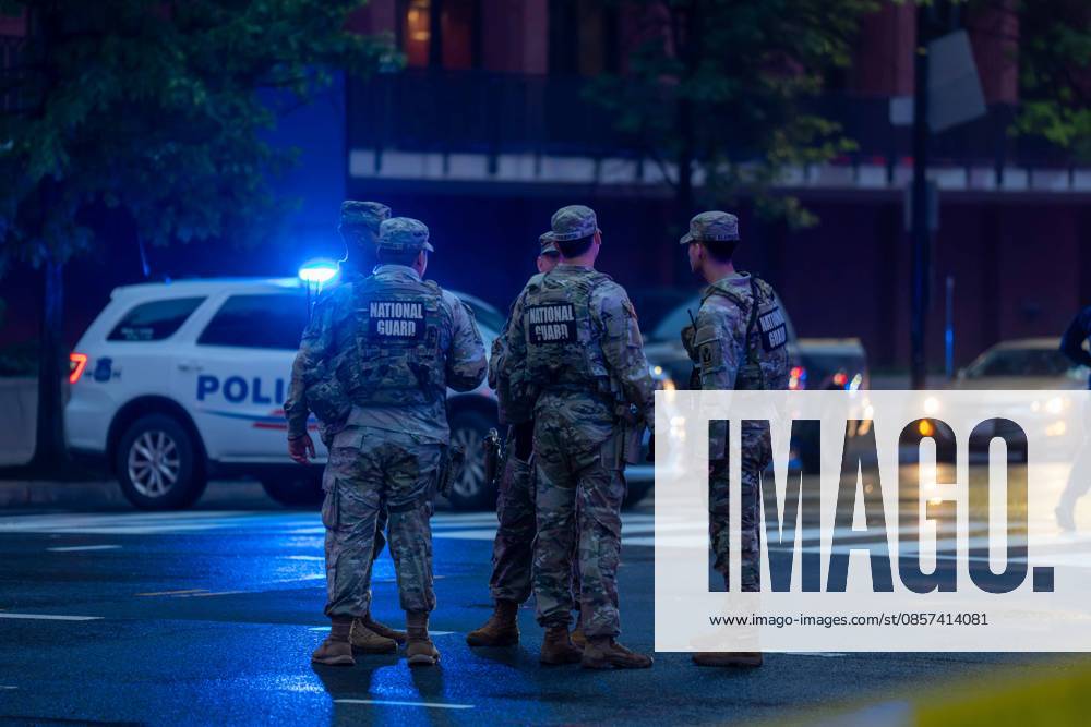 National Guardsmen talk to each other as they stand near the scene of a shooting near the White House. Washington USA - ZUMAs365 20260523_znp_s365_009