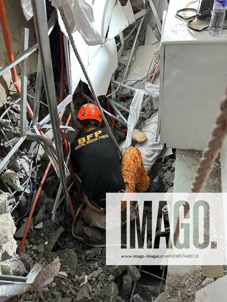 Building collapsed in Philippines, trapping multiple people, killing at least one ANGELES, PAMPANGA PROVINCE, PHILIPPINES - MAY 24: (---- - MANDATORY CREDIT - BUREAU OF FIRE PROTECTION (BFP) HANDOUT - NO MARKETING NO ADVERTISING CAMPAIGNS - DISTRIBUTED AS A SERVICE TO CLIENTS----) (EDITORS NOTE: Image depicts death) A body of a Malaysian national was recovered from the rubble of a building after it collapsed, in Angeles, Pampanga Province, Philippines, on May 24, 2026. One Malaysian national has been found dead, at least 24 were rescued alive and at least 21 are still missing, after the nine-storey building that was under construction collapsed, according to the local authorities. Search and rescue efforts are still un