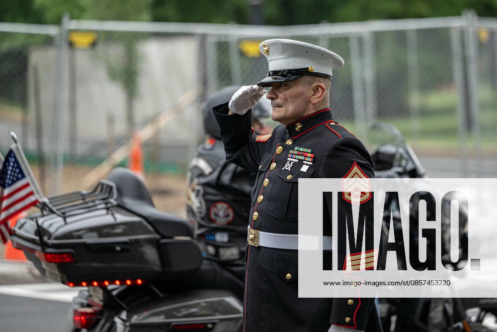 A U.S. Marine salutes as motorcyclists pass during the Rolling to Remember memorial ride in Washington, D.C., during Memorial Day weekend. Washignton United States - ZUMAk206 20260524_znp_k206_017