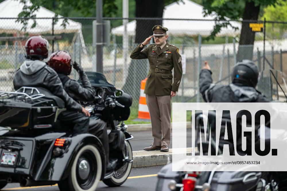A service member salutes as motorcyclists pass during the Rolling to Remember memorial ride in Washington, D.C., during Memorial Day weekend. Washignton United States - ZUMAk206 20260524_znp_k206_013