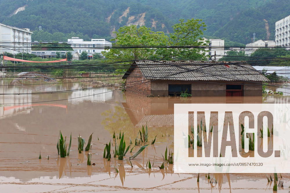 Houses and crops are submerged after extreme rainfalls trigger flash floods and geological disasters on May 24, 2026 in Yongchuan District, Chongqing City, China. Devastating rainstorms struck parts of Southwest China s Chongqing over the weekend, resulting in multiple casualties and missing people in the municipality s Yongchuan and Beibei districts. Rescue efforts are ongoing. As of 2:30 pm on May 24, local authorities reported three deaths and 17 people missing in Yongchuan, with another two people missing in Beibei.