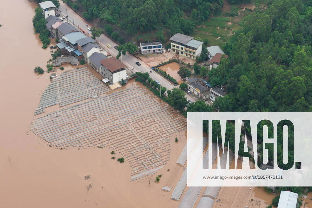 Rows of greenhouses are submerged after extreme rainfalls trigger flash floods and geological disasters on May 24, 2026 in Yongchuan District, Chongqing City, China. Devastating rainstorms struck parts of Southwest China s Chongqing over the weekend, resulting in multiple casualties and missing people in the municipality s Yongchuan and Beibei districts. Rescue efforts are ongoing. As of 2:30 pm on May 24, local authorities reported three deaths and 17 people missing in Yongchuan, with another two people missing in Beibei.