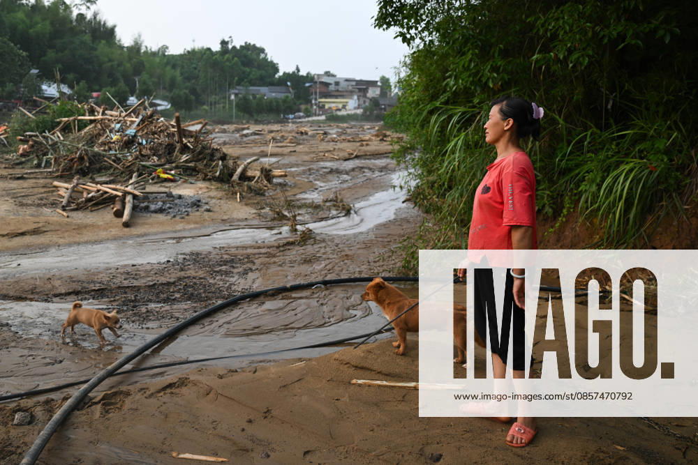 A villager looks at the disaster-hit area after extreme rainfalls trigger flash floods and geological disasters on May 24, 2026 in Yongchuan District, Chongqing City, China. Devastating rainstorms struck parts of Southwest China s Chongqing over the weekend, resulting in multiple casualties and missing people in the municipality s Yongchuan and Beibei districts. Rescue efforts are ongoing. As of 2:30 pm on May 24, local authorities reported three deaths and 17 people missing in Yongchuan, with another two people missing in Beibei.