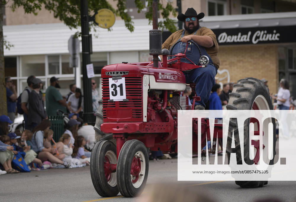 (260525) -- DELTA, May 25, 2026 -- A man drives a tractor on the street during the Ladner May Days parade in Ladner, British Columbia, Canada, May 24, 2026. (Photo by Xinhua) CANADA-BRITISH COLUMBIA-LADNER-MAY DAYS PARADE LiangxSen