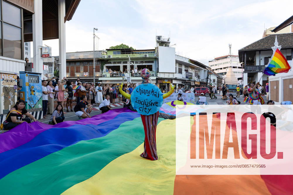 Sirisak Chaited, representative of the Chiang Mai Pride organizing committee, poses on a large rainbow flag during the Chiang Mai Pride Parade. The Chiang Mai Pride Parade 2026 took place in Chiang Mai, Thailand. Chiang Mai province holds Thailandis first Pride Month celebrations annually, promoting gender equality, diversity, and human rights as part of Pride Month activities in northern Thailand. Chiang Mai Thailand - ZUMAs197 20260524_aaa_s197_149