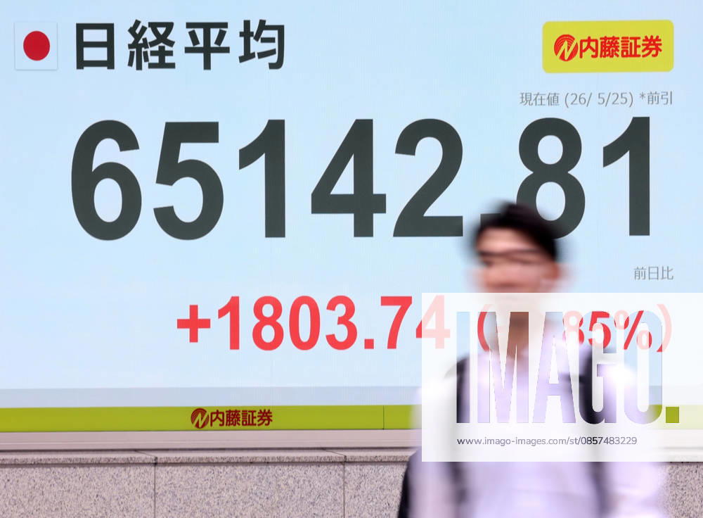 Tokyo, Japan - A pedestrian passes before a share prices board in Tokyo on Monday, May 25, 2026. Japan s share prices rose 1803.74 yen to close at 65,142.81 yen at the morning session of the Tokyo Stock Exchange. (photo by Yoshio Tsunoda AFLO) aflo_331918489