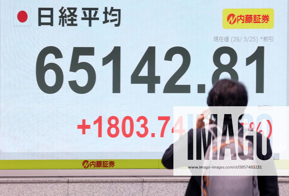 Tokyo, Japan - A pedestrian passes before a share prices board in Tokyo on Monday, May 25, 2026. Japan s share prices rose 1803.74 yen to close at 65,142.81 yen at the morning session of the Tokyo Stock Exchange. (photo by Yoshio Tsunoda AFLO) aflo_331918492