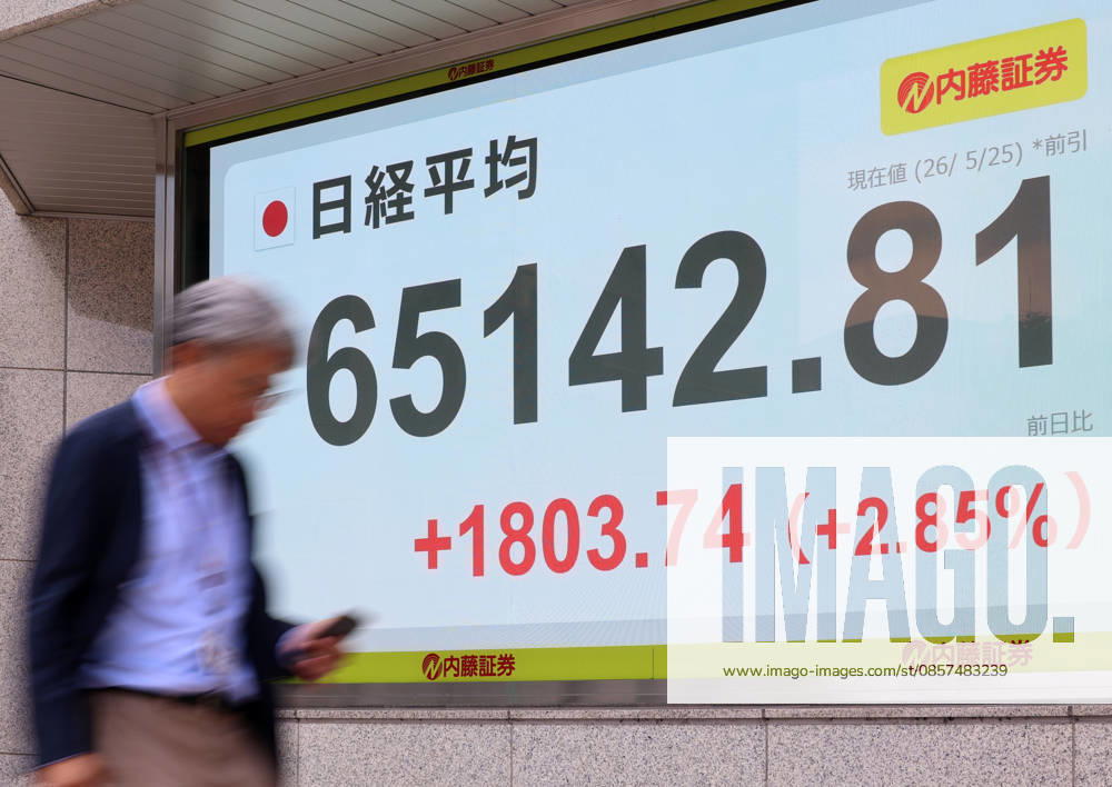Tokyo, Japan - A pedestrian passes before a share prices board in Tokyo on Monday, May 25, 2026. Japan s share prices rose 1803.74 yen to close at 65,142.81 yen at the morning session of the Tokyo Stock Exchange. (photo by Yoshio Tsunoda AFLO) aflo_331918516