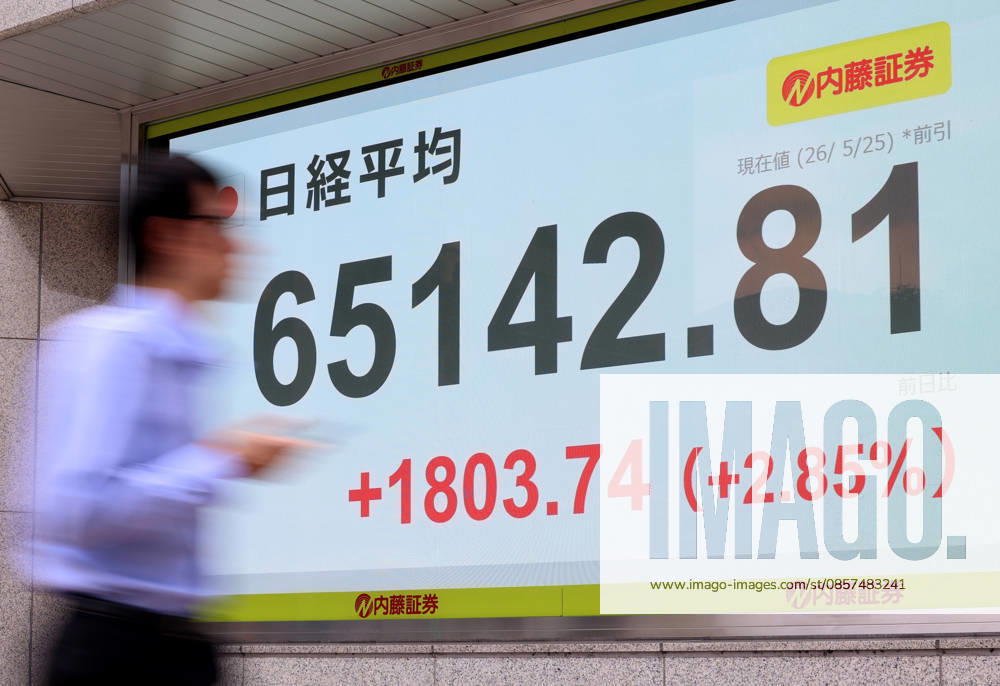 Tokyo, Japan - A pedestrian passes before a share prices board in Tokyo on Monday, May 25, 2026. Japan s share prices rose 1803.74 yen to close at 65,142.81 yen at the morning session of the Tokyo Stock Exchange. (photo by Yoshio Tsunoda AFLO) aflo_331918525