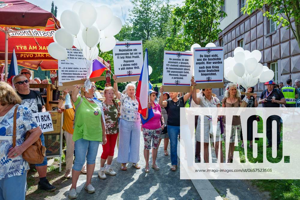 Opponents of reconciliation with Sudeten Germans holding their signs during a commemorative ceremony honoring the victims of Nazism in Brno, Czech Republic, on May 25, 2026. The 76th Congress of Sudeten Germans took place in Brno, Czech Republic, from May 22 to 25, 2026, marking the first time the event was held in the country. Brno Czech Republic - ZUMAc315 20260525_zsp_c315_034