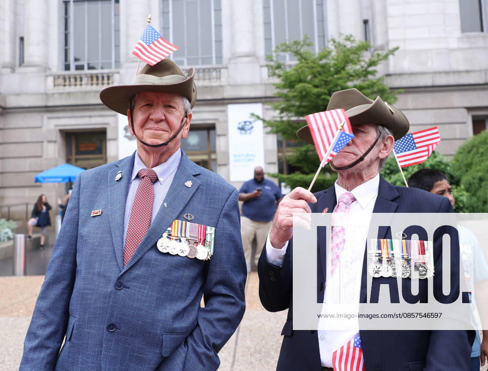 Veterans with American flags watch the National Memorial Day Parade in Washington, DC, USA, on May 25, 2026. The parade has been held annually since 2005, marking its 21st anniversary. Washington USA - ZUMAs337 20260525_znp_s337_031