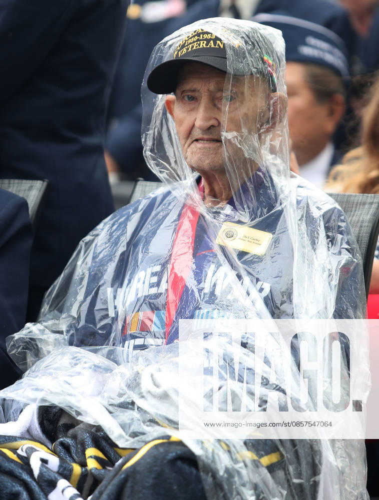 A US military veteran who served in the Korean War wears a poncho in the rain waits to take part in the National Memorial Day Parade on Constitution Avenue in Washington, DC, USA, on May 25, 2026. The parade has been held annually since 2005, marking its 21st anniversary. Washington USA - ZUMAs337 20260525_znp_s337_011