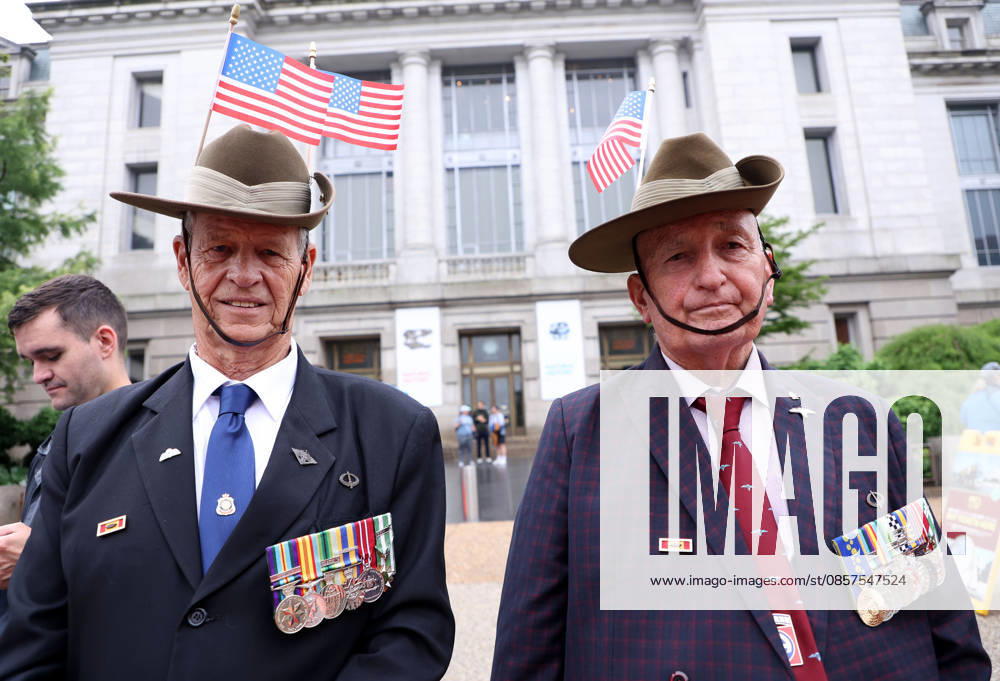 Veterans with American flags watch the National Memorial Day Parade in Washington, DC, USA, on May 25, 2026. The parade has been held annually since 2005, marking its 21st anniversary. Washington USA - ZUMAs337 20260525_znp_s337_030