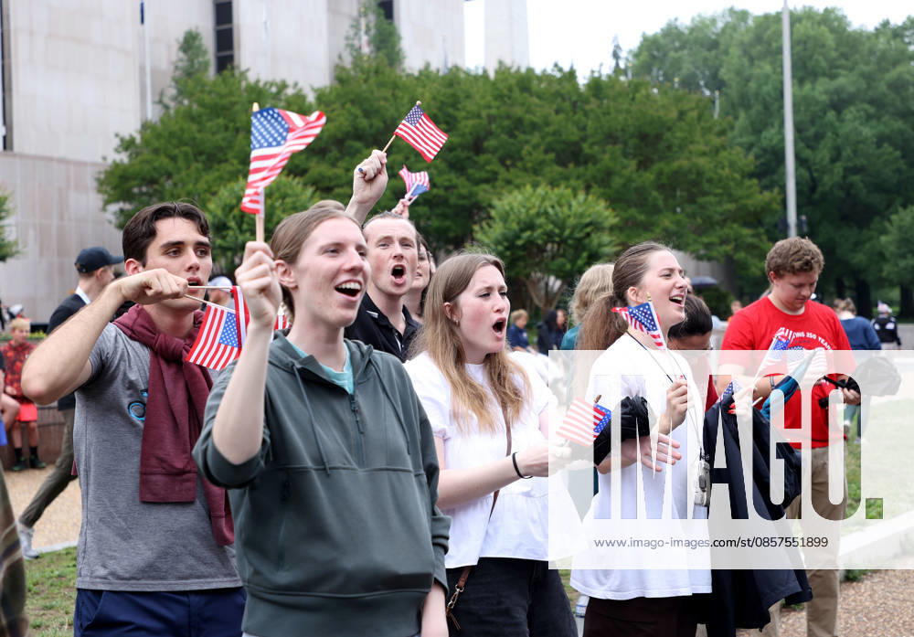 National Memorial Day Parade in Washington DC, USA. Attendees holding American flags watch the National Memorial Day Parade on Constitution Avenue in Washington, DC, USA, on May 25, 2026. The parade has been held annually since 2005, marking its 21st anniversary. Washington USA